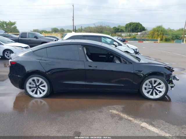 5YJ3E1EB8NF197023 Tesla 2022