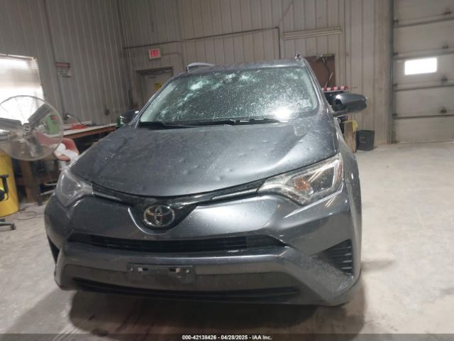 JTMZFREV9JD133607 Toyota RAV4 LE