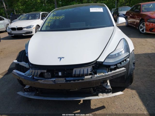 5YJ3E1EB0JF151499 Tesla 2018