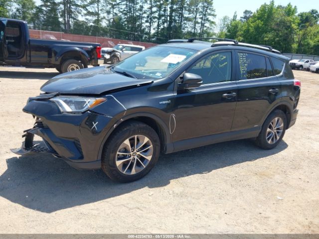 2018 TOYOTA RAV4 HYBRID JTMRJREV9JD256287 Photo 1