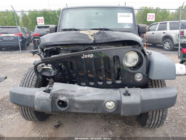 1C4HJWDG9EL268853 Jeep Wrangler Unlimited Sport