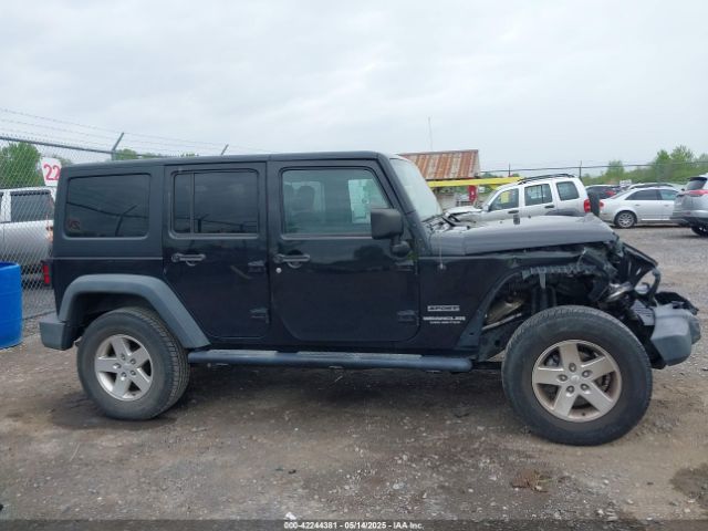 1C4HJWDG9EL268853 Jeep Wrangler Unlimited Sport
