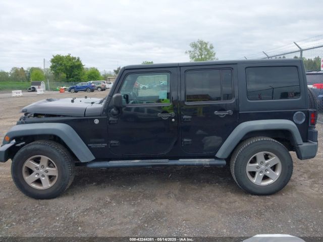 1C4HJWDG9EL268853 Jeep Wrangler Unlimited Sport