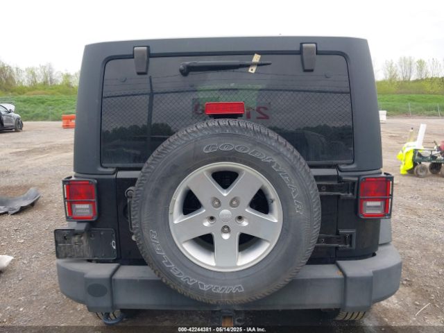 1C4HJWDG9EL268853 Jeep Wrangler Unlimited Sport