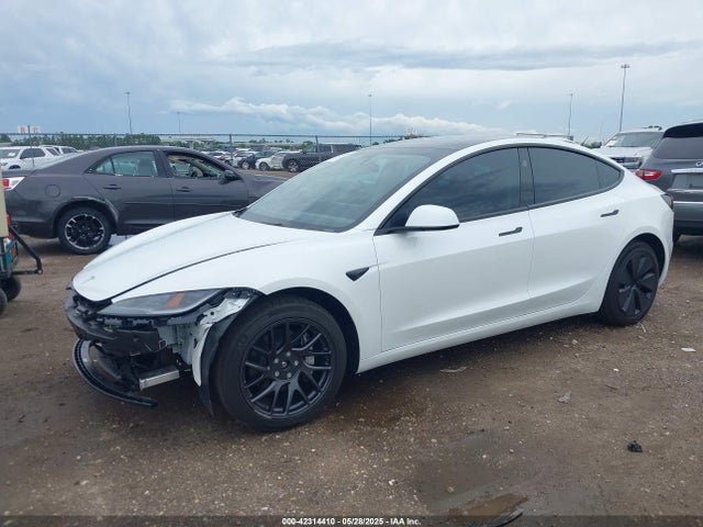 5YJ3E1EBXRF770011 Tesla 2024