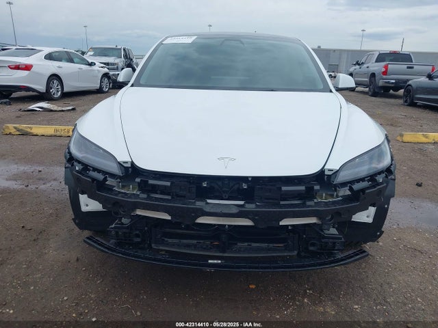 5YJ3E1EBXRF770011 Tesla 2024