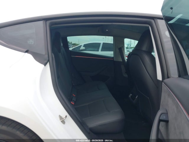5YJ3E1EBXRF770011 Tesla 2024