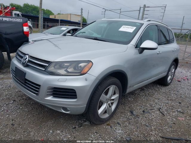 2011 VOLKSWAGEN TOUAREG WVGFF9BP0BD000384 Photo 1
