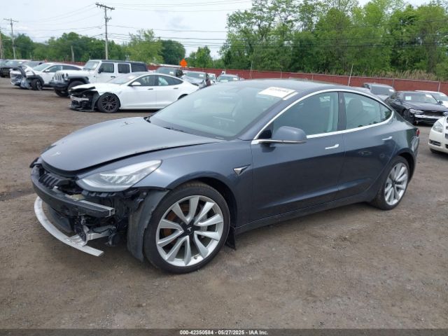 5YJ3E1EC7LF586659 Tesla 2020