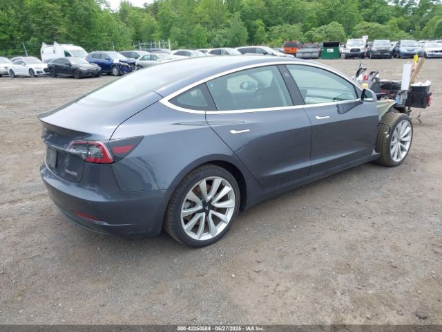5YJ3E1EC7LF586659 Tesla 2020