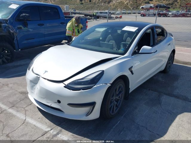 5YJ3E1EB1NF106433 Tesla 2022