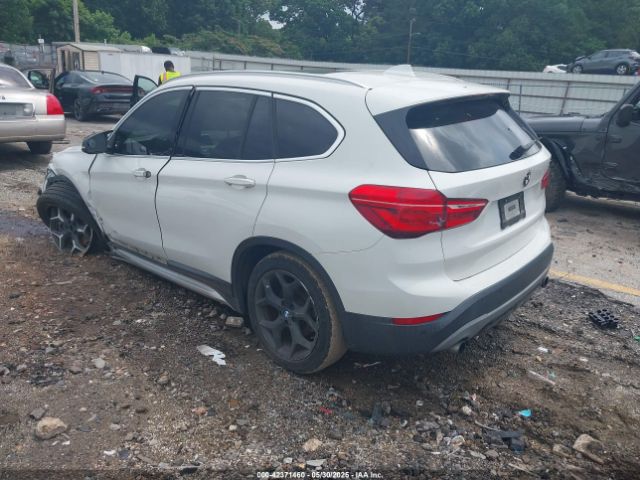 2016 BMW X1 WBXHT3C31G5E54407 Photo 2