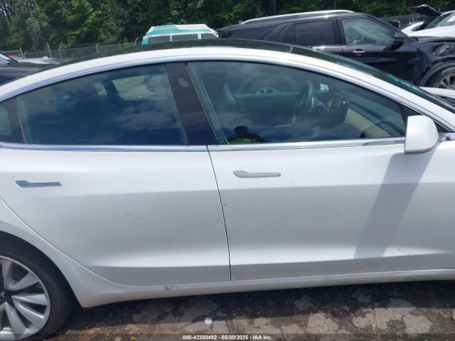 5YJ3E1EA4LF661560 Tesla 2020
