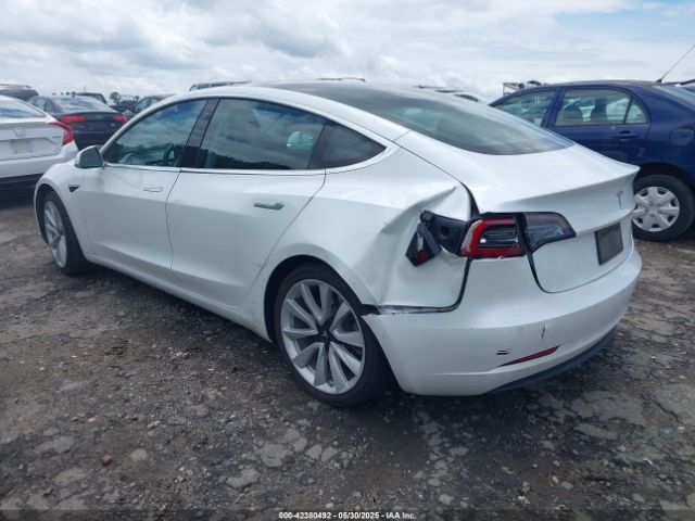 5YJ3E1EA4LF661560 Tesla 2020