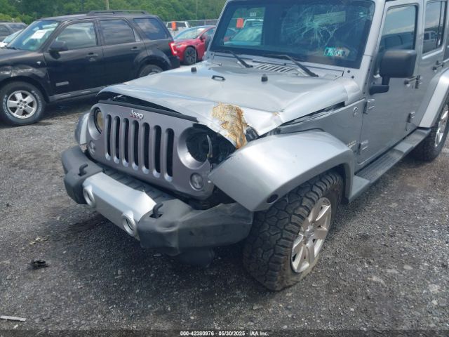 1C4BJWEG0EL129229 Jeep Wrangler Unlimited Sahara