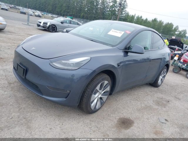 2023 TESLA MODEL Y 7SAYGDED0PF934319 Photo 1