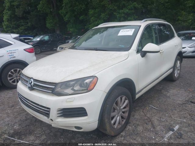 2011 VOLKSWAGEN TOUAREG WVGFF9BPXBD006399 Photo 1