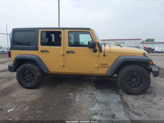 1C4BJWDG9EL100345 Jeep Wrangler Unlimited Sport