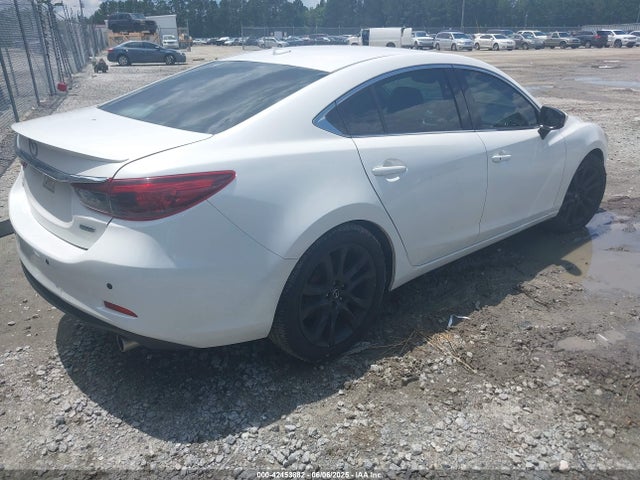 JM1GJ1W51G1477142 Mazda py