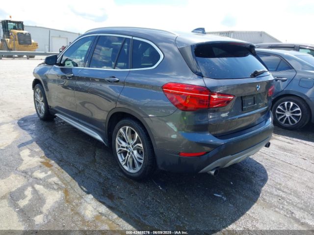 2017 BMW X1 WBXHT3Z38H4A55086 Photo 2