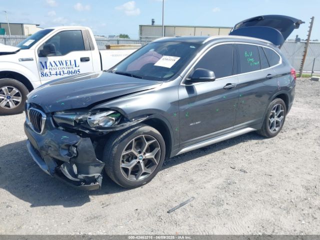 2018 BMW X1 WBXHT3C38J5F88807 Photo 1