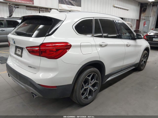WBXHU7C38J5L06893 BMW X1