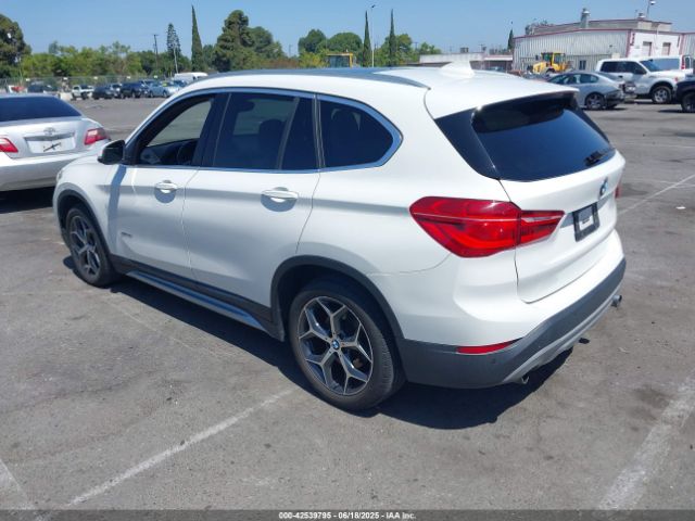 2017 BMW X1 WBXHT3C30H5F75950 Photo 2