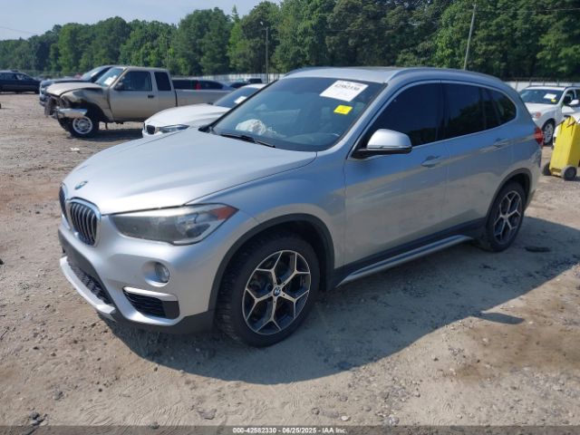 2018 BMW X1 WBXHT3C39J5L27926 Photo 1