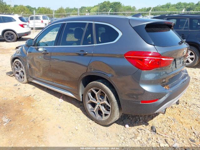 2016 BMW X1 WBXHT3C31G5E47828 Photo 2