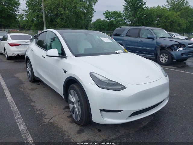 2023 TESLA MODEL Y 7SAYGAEE5PF660381 Photo 0