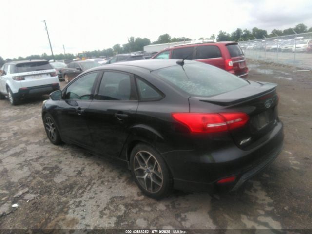 2015 FORD FOCUS 1FADP3F27FL304883 Photo 2