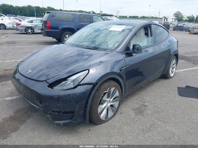 2024 TESLA MODEL Y 7SAYGDEE2RA244659 Photo 1