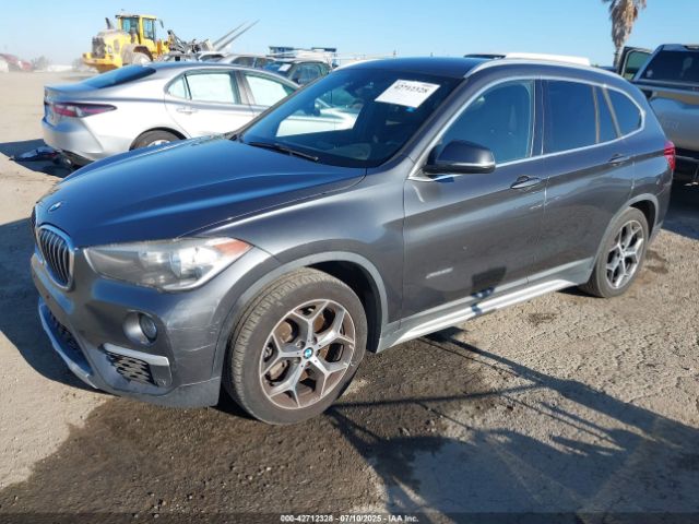 2016 BMW X1 WBXHT3C30G5E55323 Photo 1