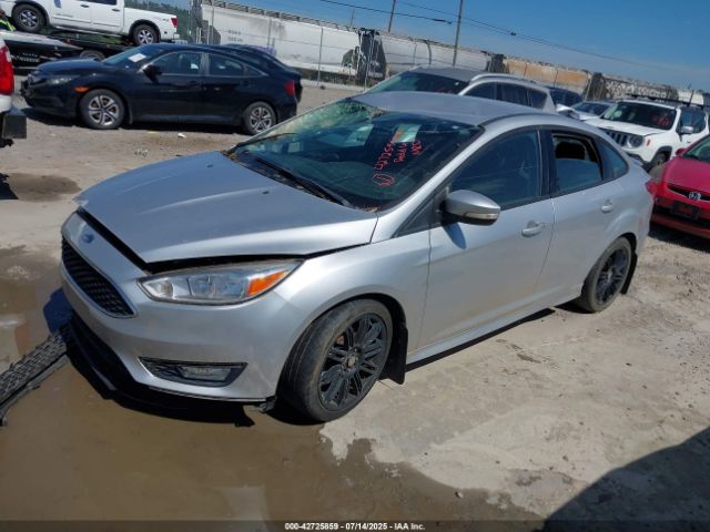 2016 FORD FOCUS 1FADP3F26GL296597 Photo 1