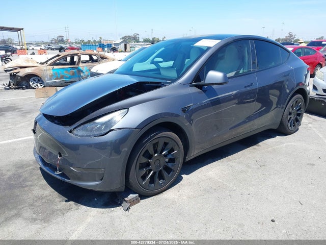 2023 TESLA MODEL Y 7SAYGDEE9PF900386 Photo 1