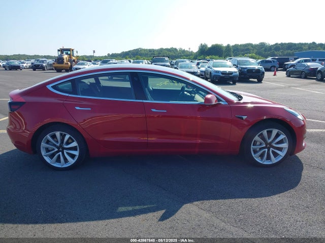 5YJ3E1EB7JF065574 Tesla 2018