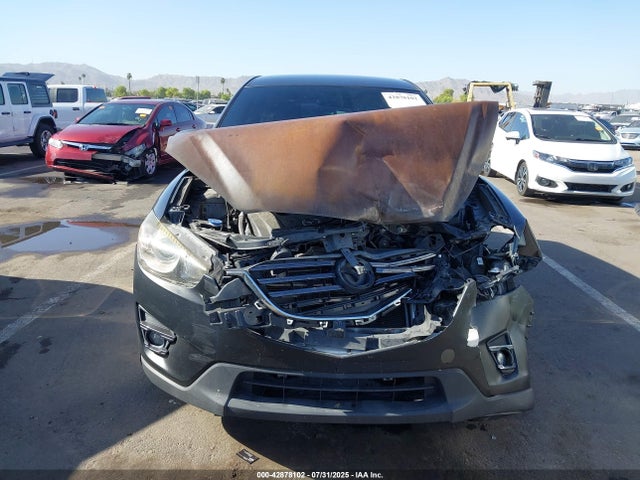 JM3KE2CY6G0887841 Mazda py