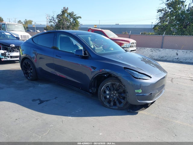 2023 TESLA MODEL Y 7SAYGDEE3PF831212 Photo 0