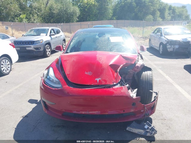 5YJ3E1EB9JF086412 Tesla 2018