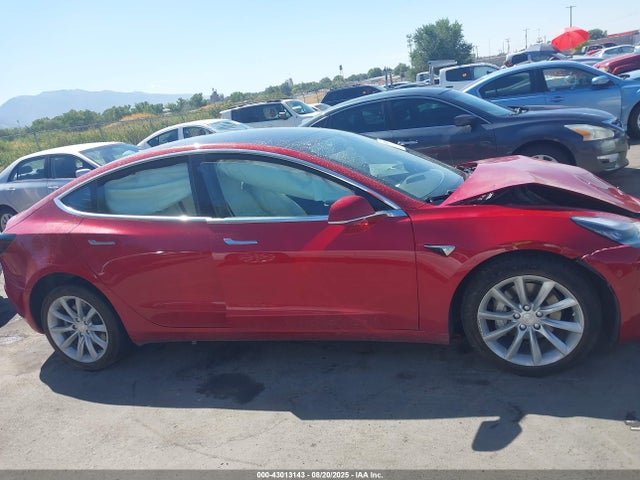 5YJ3E1EB9JF086412 Tesla 2018