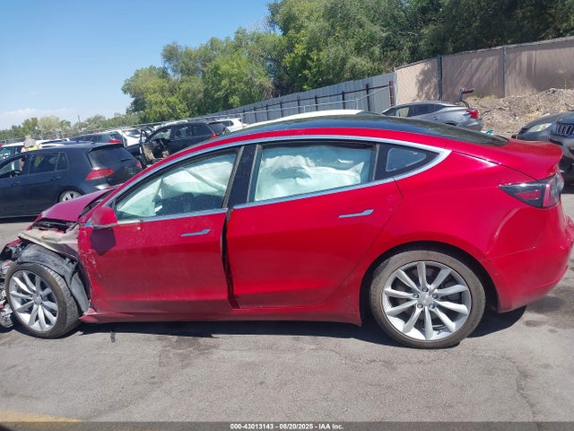 5YJ3E1EB9JF086412 Tesla 2018