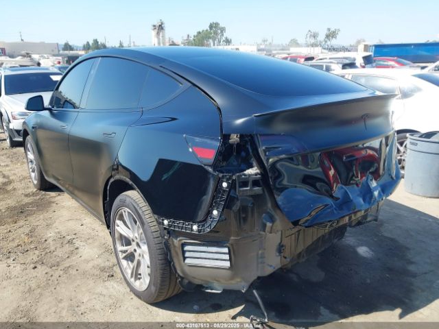 2024 TESLA MODEL Y 7SAYGDEEXRA238558 Photo 2