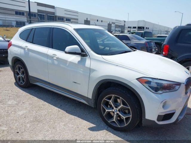 2017 BMW X1 WBXHT3Z38H4A52057