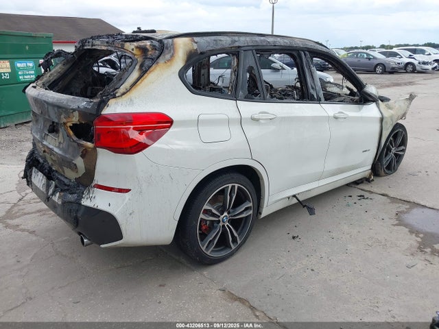 2017 BMW X1 WBXHT3C35H5F70971 Photo 3