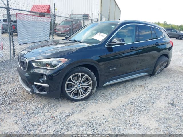 2016 BMW X1 WBXHT3C32G5E50186 Photo 1