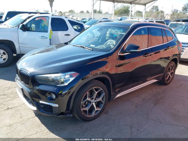 2019 BMW X1 WBXHT3C54K5L37749 Photo 1
