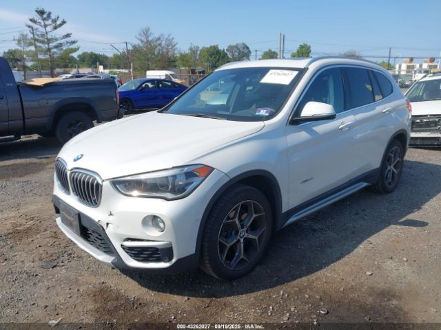 2016 BMW X1 WBXHT3C37GP887814 Photo 1