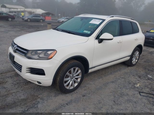 2011 VOLKSWAGEN TOUAREG WVGFF9BPXBD005639 Photo 1
