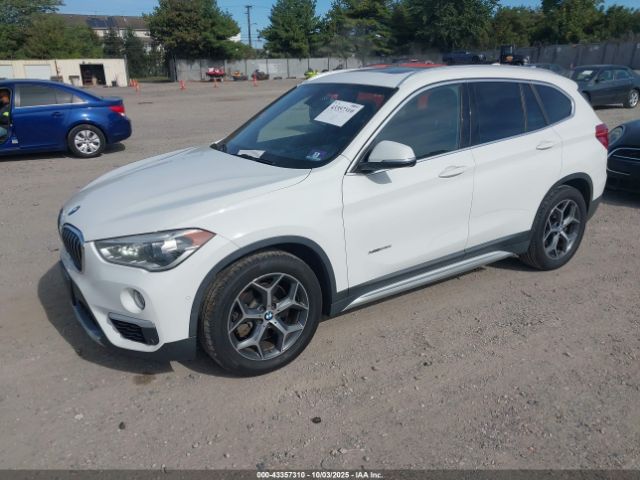 2017 BMW X1 WBXHT3C32H5F80843 Photo 1
