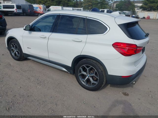2017 BMW X1 WBXHT3C32H5F80843 Photo 2